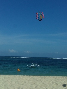 Catamaran for rent getting around & the kite in the blue sea & sky