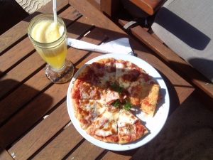 Pizza & local orange juice from public canteen in the beach, our late lunch